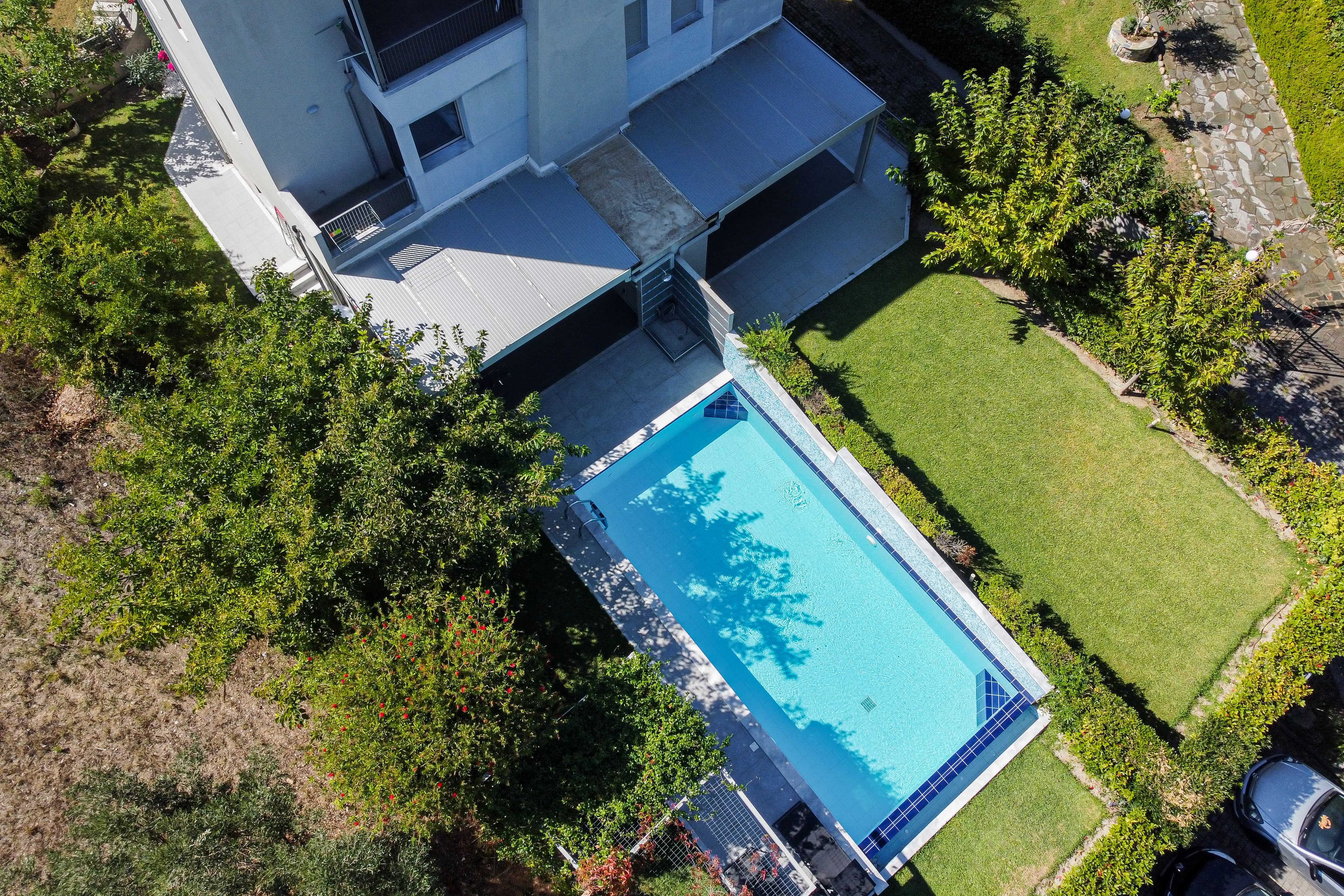Outdoor courtyard with pool and Aegean view
